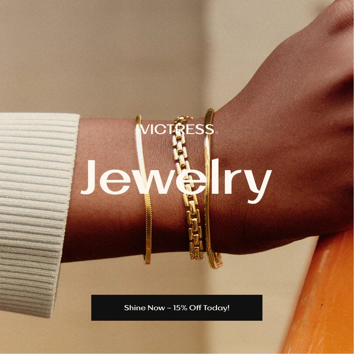 Woman wearing layered gold bracelets jewelry on wrist, close-up, neutral background