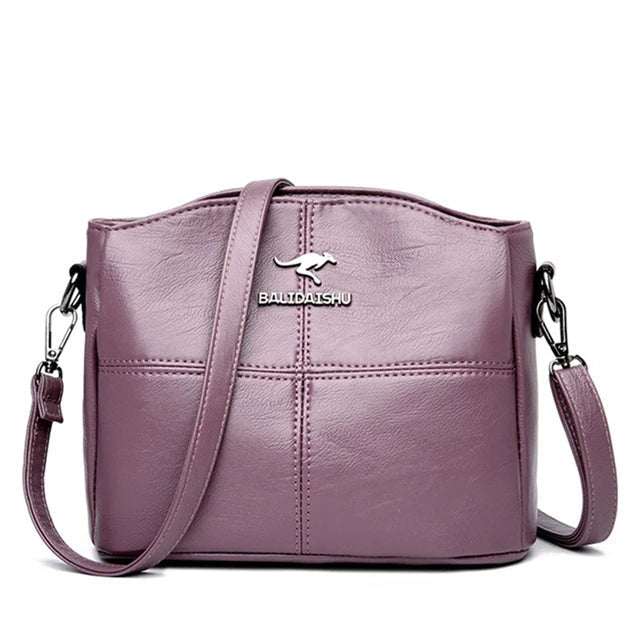 Elegante geborduurde leren tas en crossbodytas voor dames