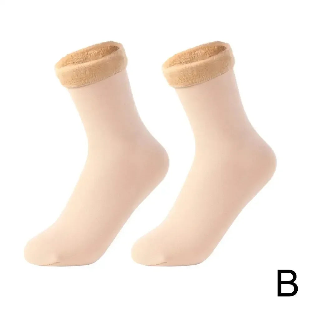 Pair of beige ankle socks with plush fleece lining, displayed on white background