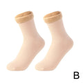 Pair of beige ankle socks with plush fleece lining, displayed on white background