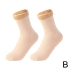 Pair of beige ankle socks with plush fleece lining, displayed on white background