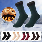 Warm fleece-lined winter socks in various colors, ideal for cold weather, shown on snowy background.