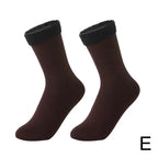 Pair of brown ankle socks with black fleece cuffs, cozy women's winter footwear