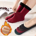 Warm fleece-lined thermal socks in red, hand-stretching to show softness, assorted color options