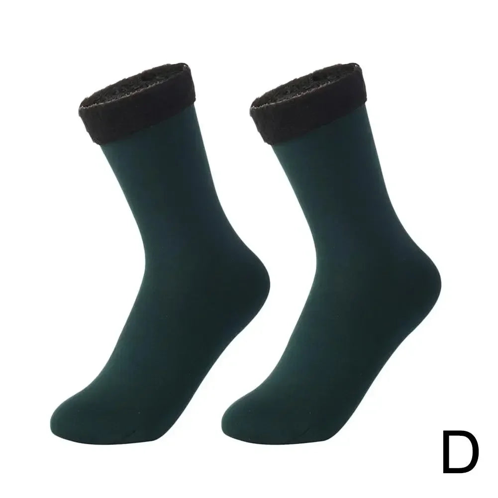 Pair of dark green ankle socks with black fleece cuffs on white background