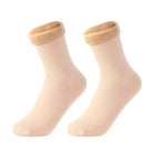 Pair of beige ankle socks with plush, fuzzy cuffs on white background